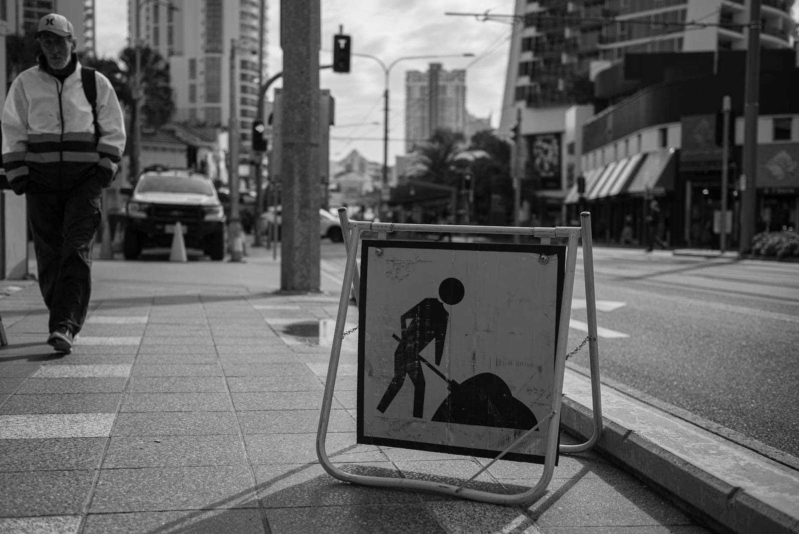 Black and white image of a construction sign in Surfers Paradise, Queensland, Australia.