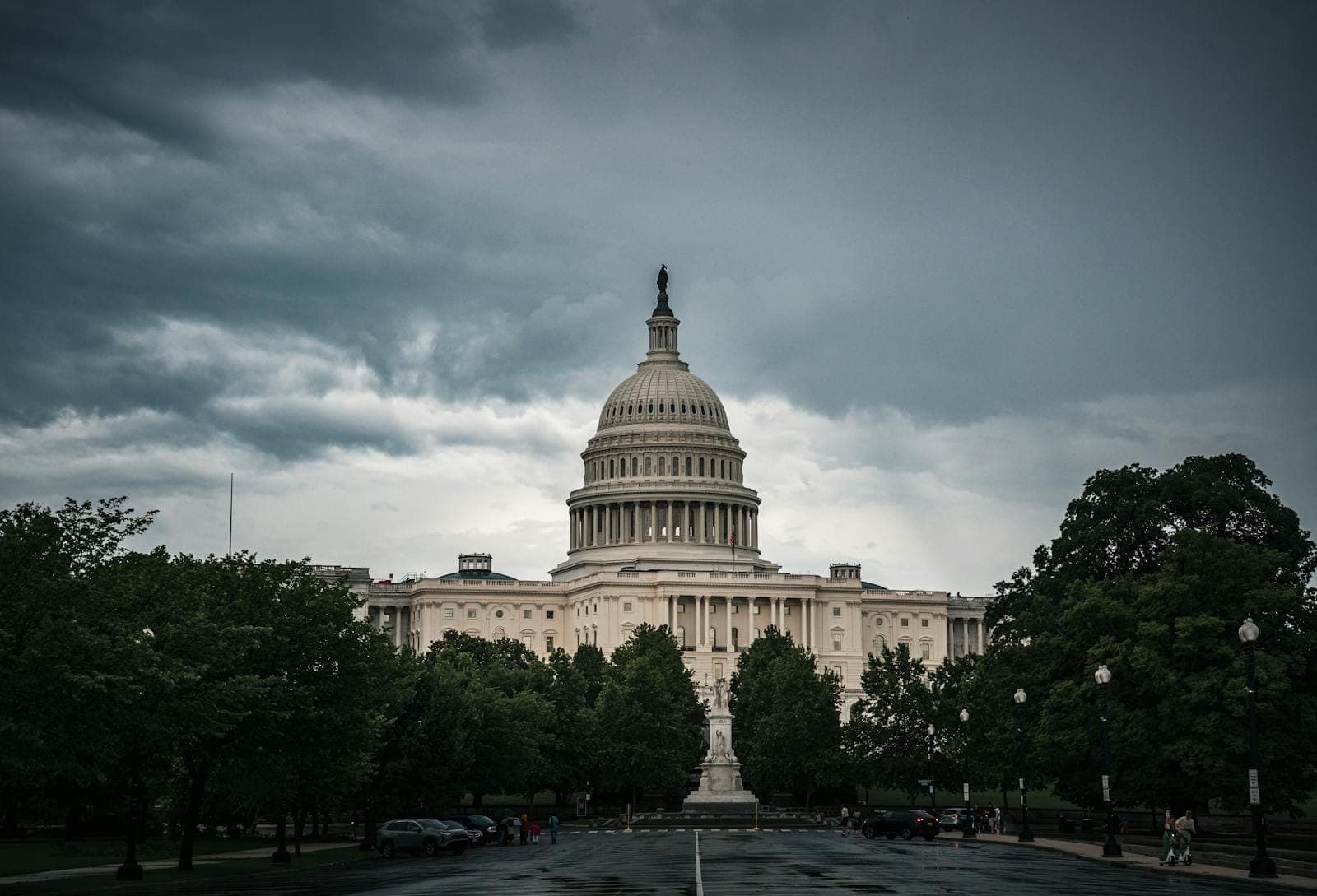 National landmarks captured with a dramatic sky, Washington DC's Capitol shines.