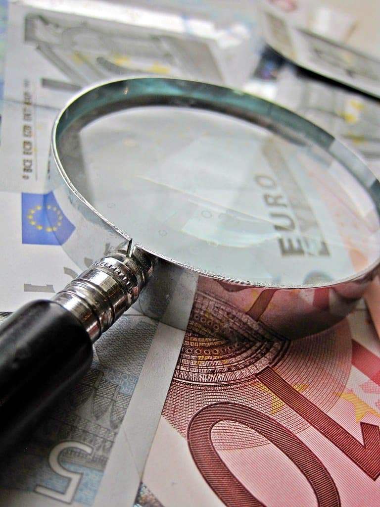 Euros and Magnifying Glass