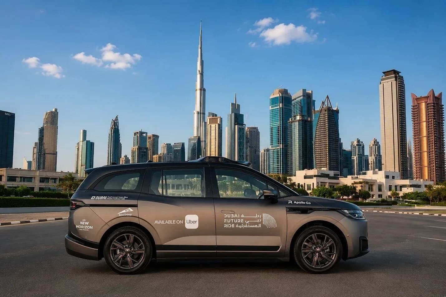 A Baidu Apollo Go driverless car with Uber and Dubai Future Ride livery parked in front of the Dubai skyline