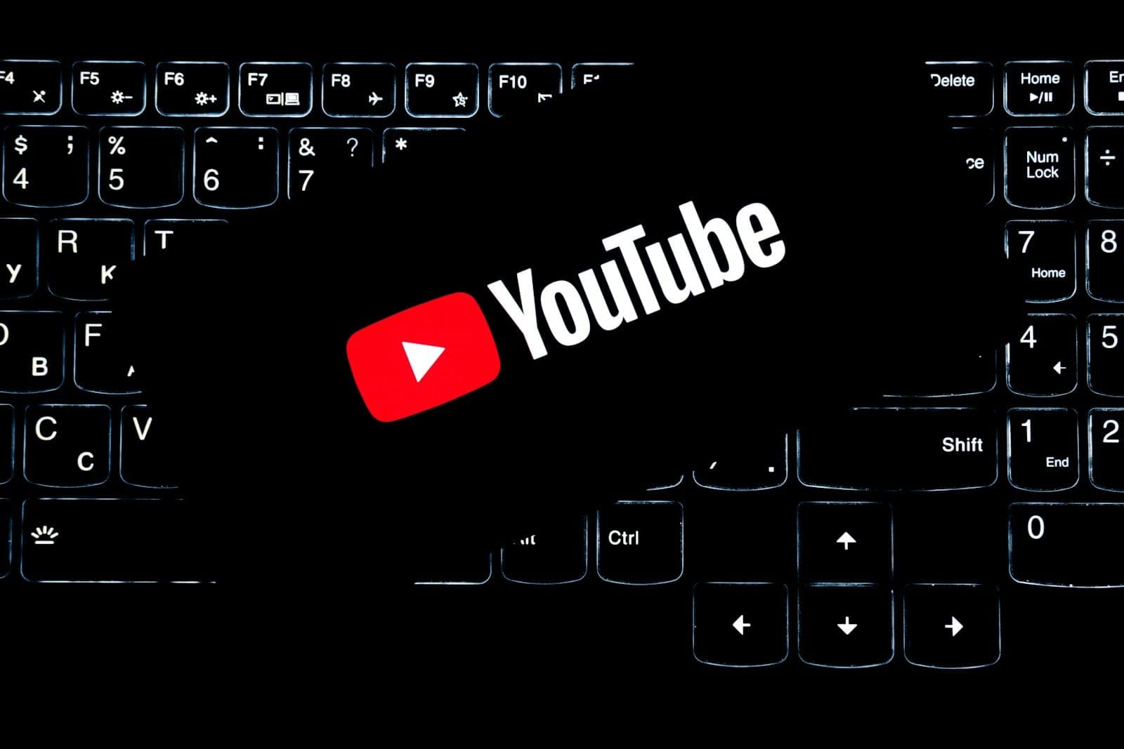 Youtube logo on a backlit keyboard.