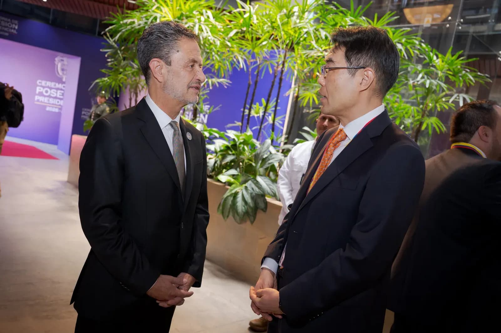 Officials in conversation at the presidential inauguration ceremony in Cali, Colombia, in August 2026