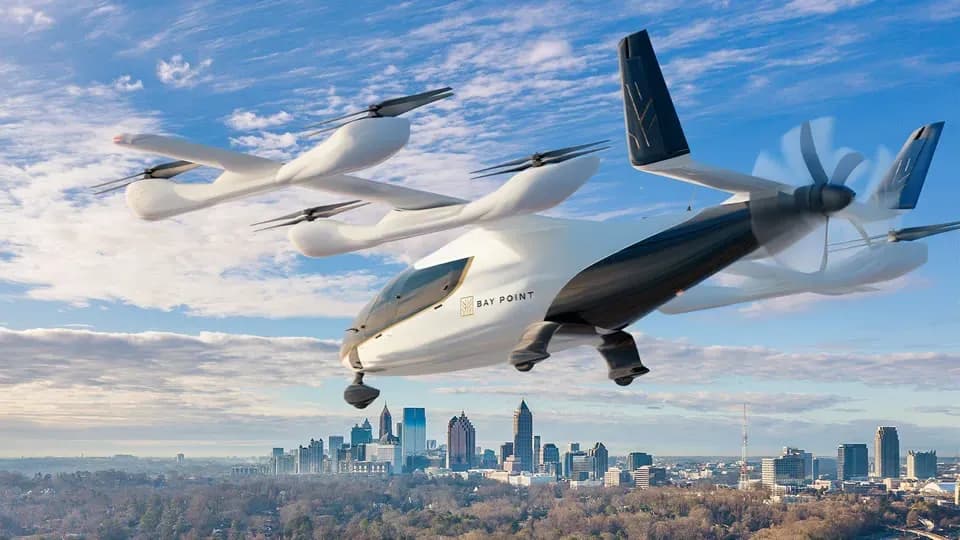 Eve Air Mobility eVTOL aircraft in flight over a city skyline