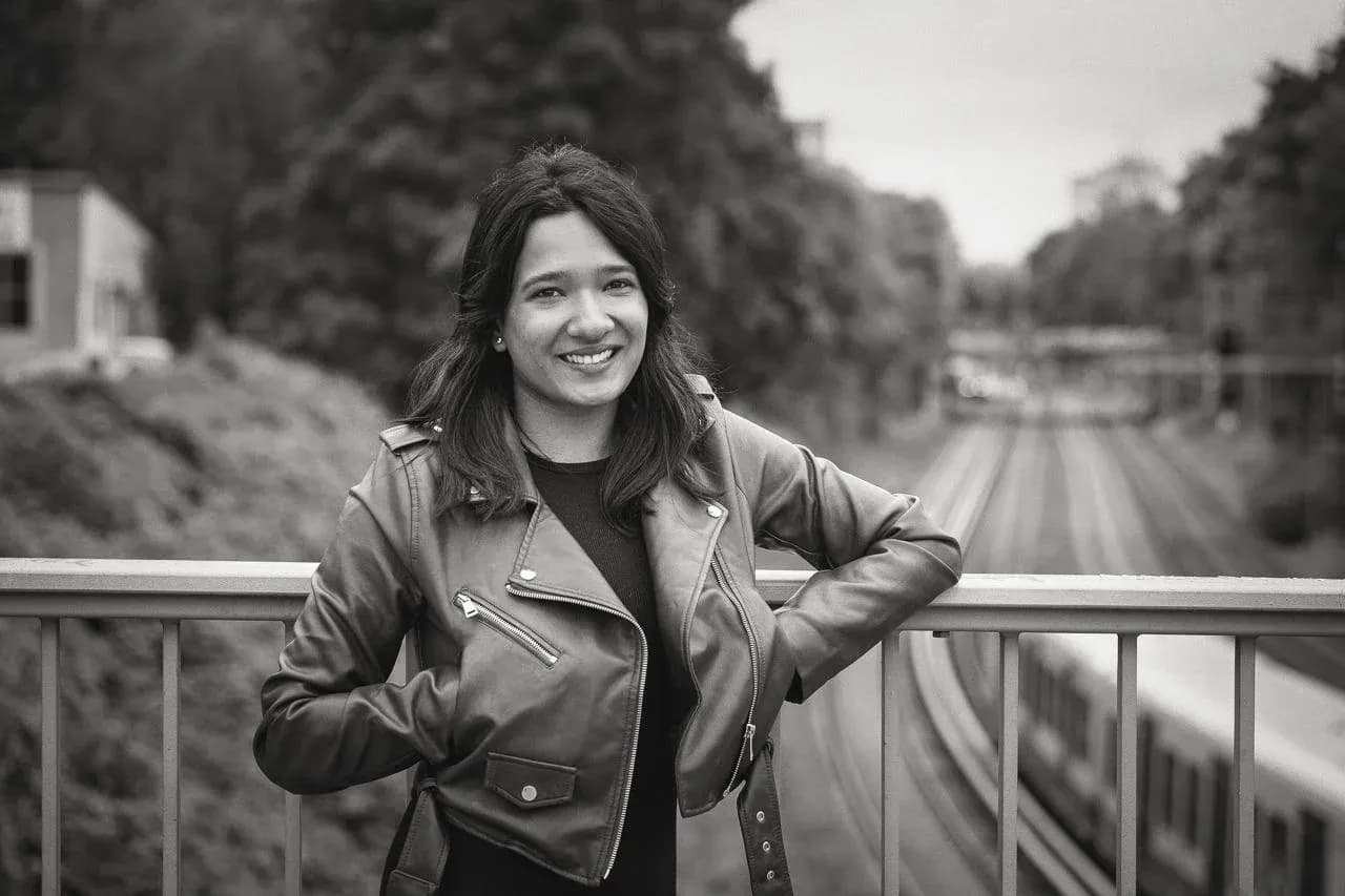 Krshna Prashant, Freehand's first US marketing lead, standing on a bridge above railway tracks