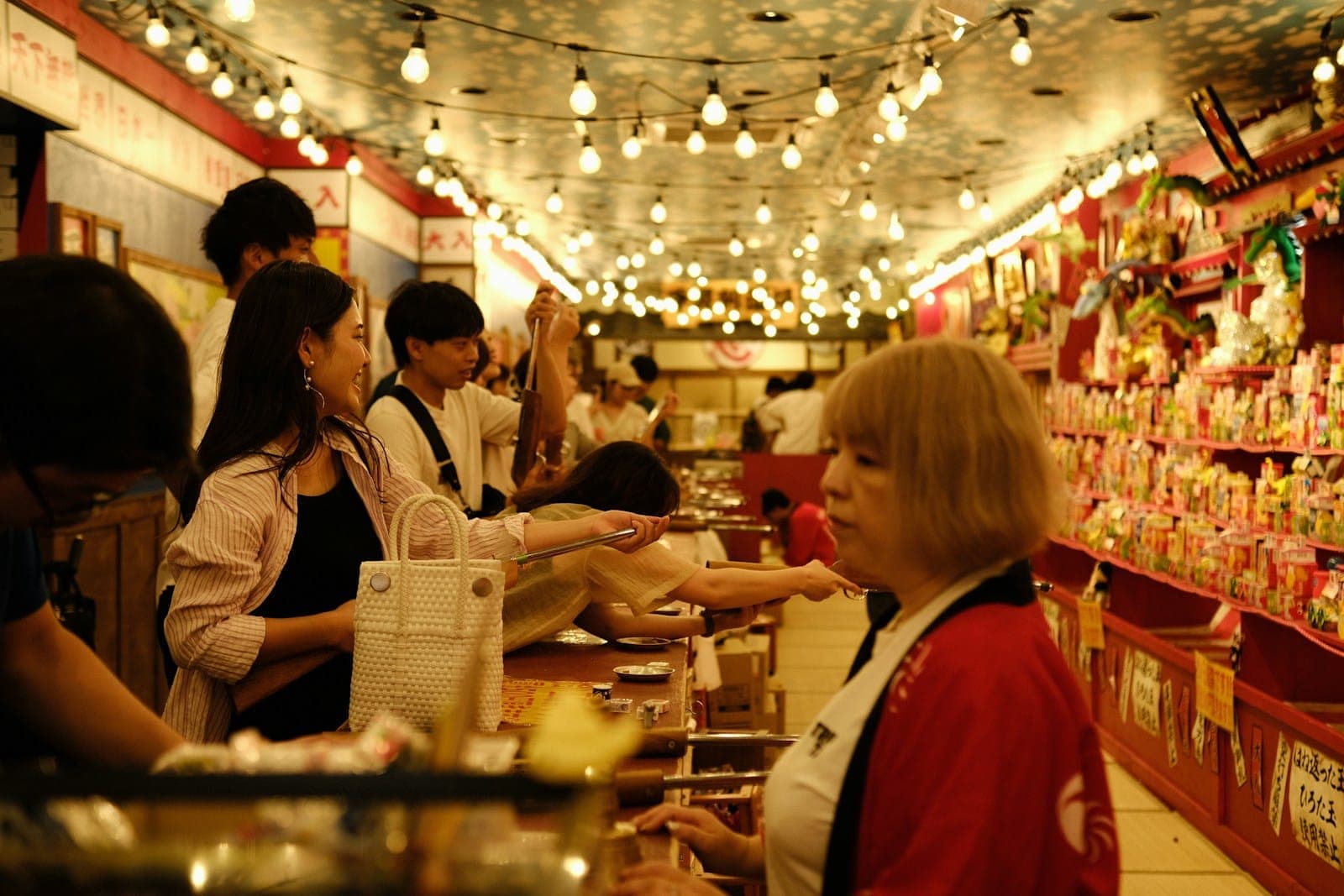 a group of people standing at a counter in a store