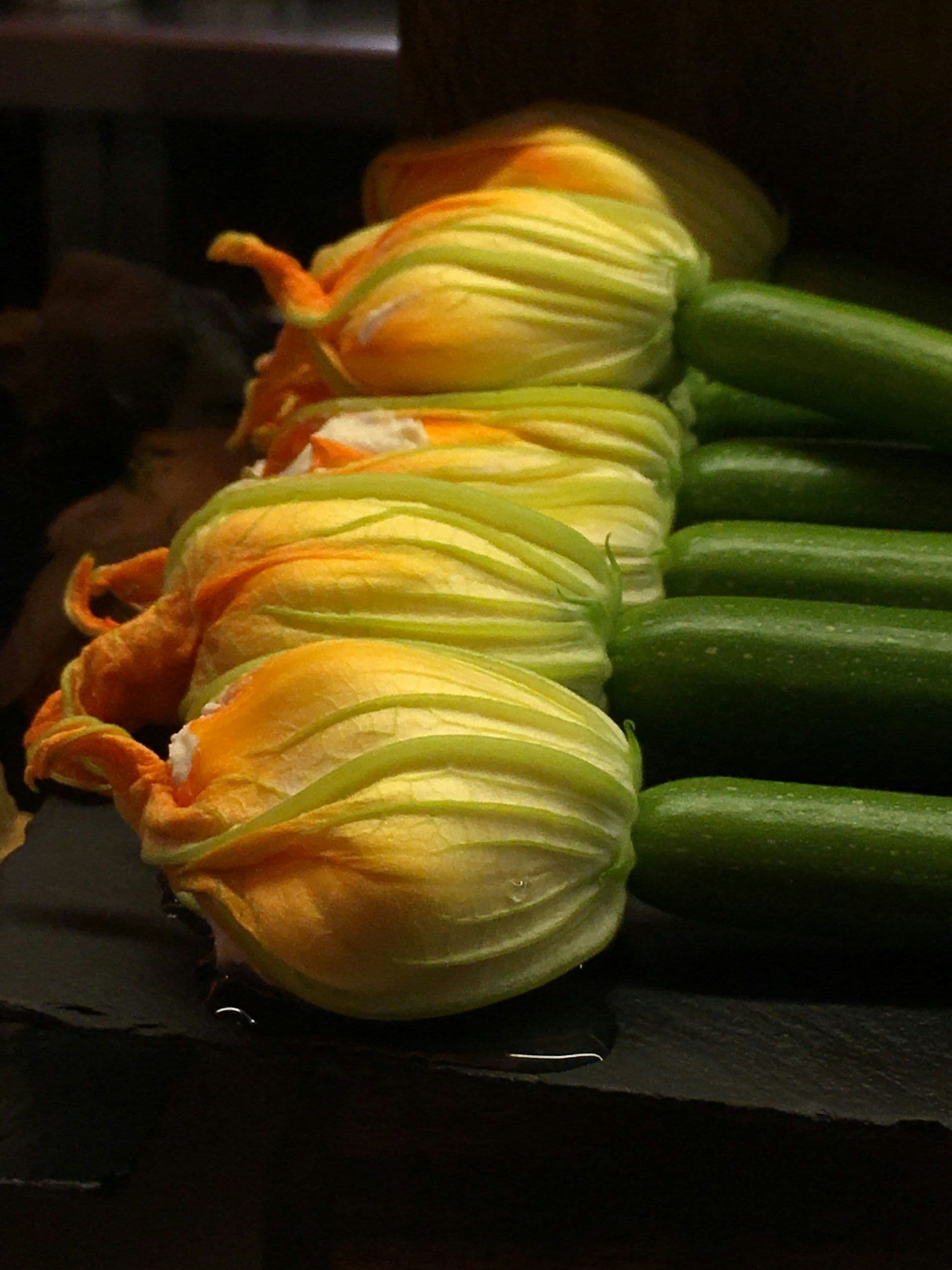 How to grow and cook stuffed courgette flowers filled with herbed ricotta, lightly fried until crisp, a summer classic made simple.