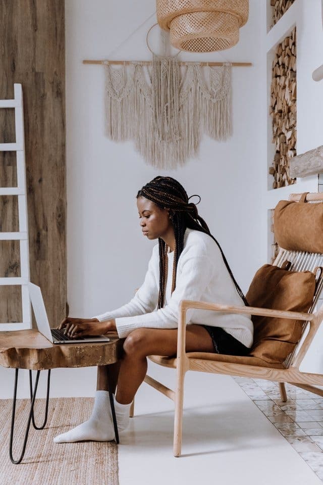 Young self-employed woman working at her laptop