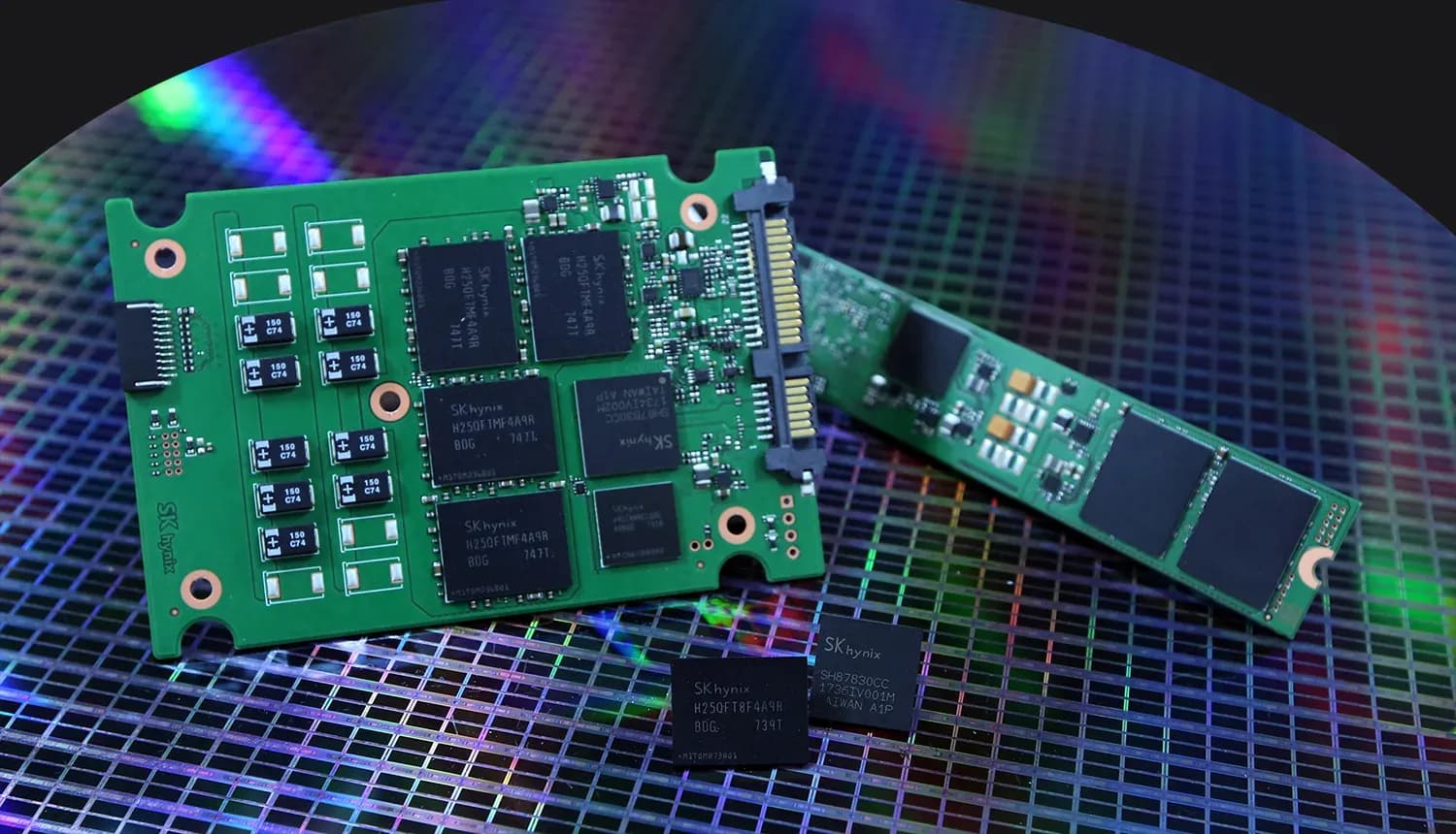 SK hynix NAND flash memory packages, a flash controller and two solid state drives resting on a silicon wafer.