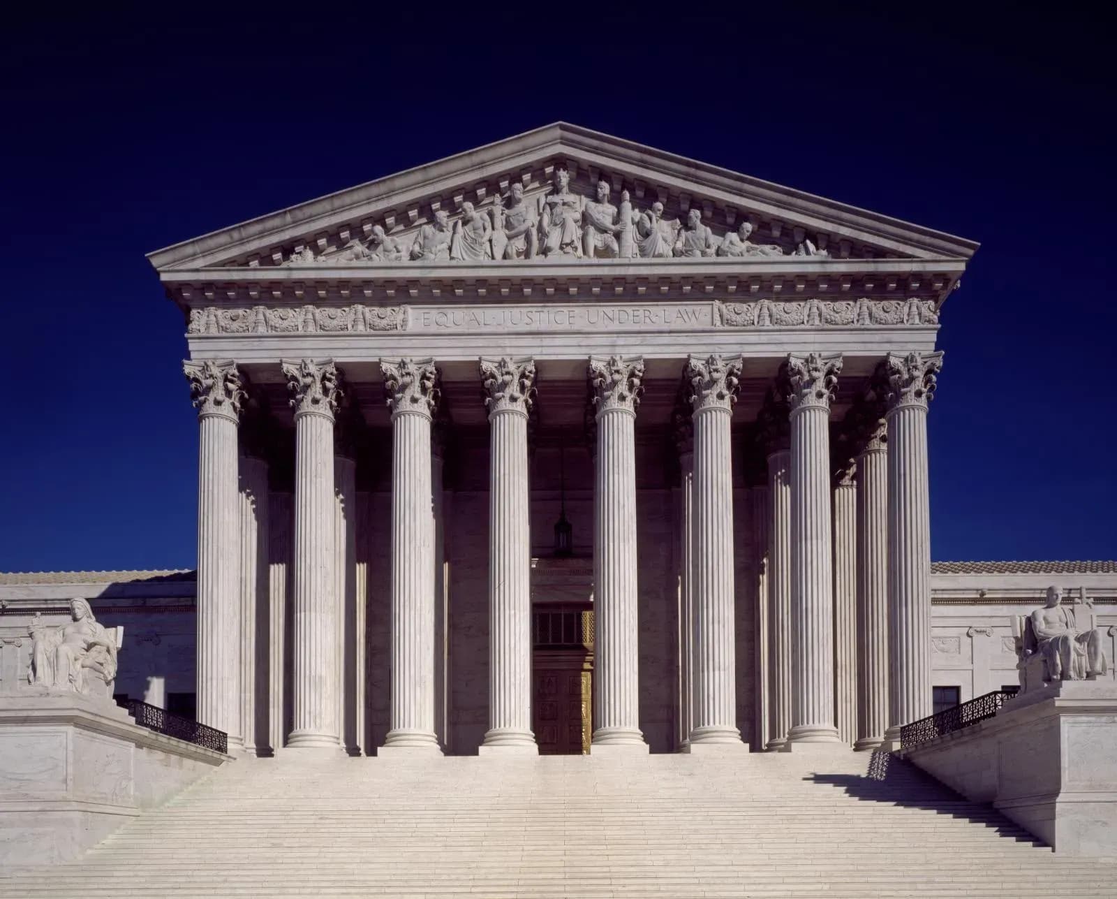 US Supreme Court building with scales of justice representing the IEEPA tariffs ruling