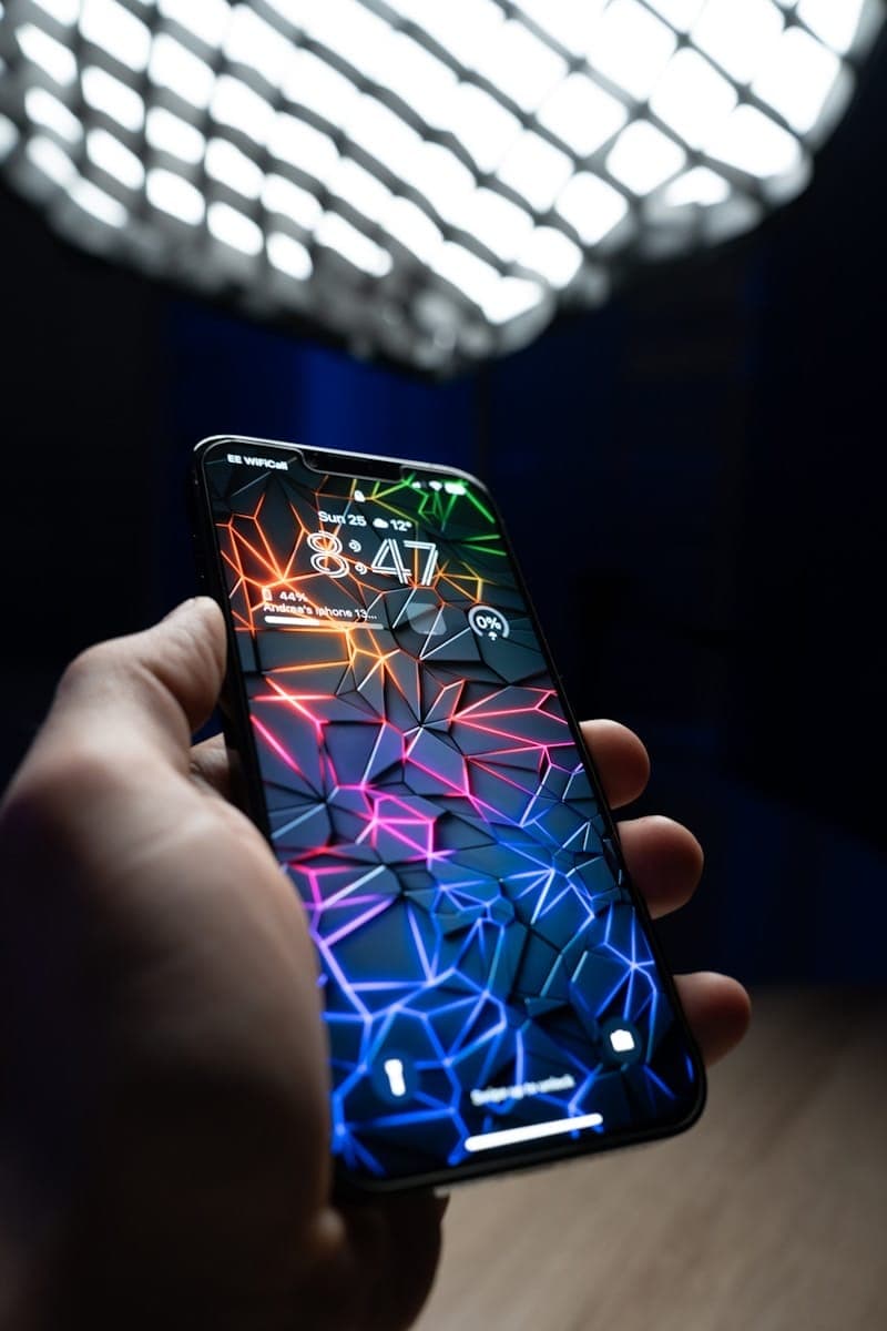 a hand holding a cell phone