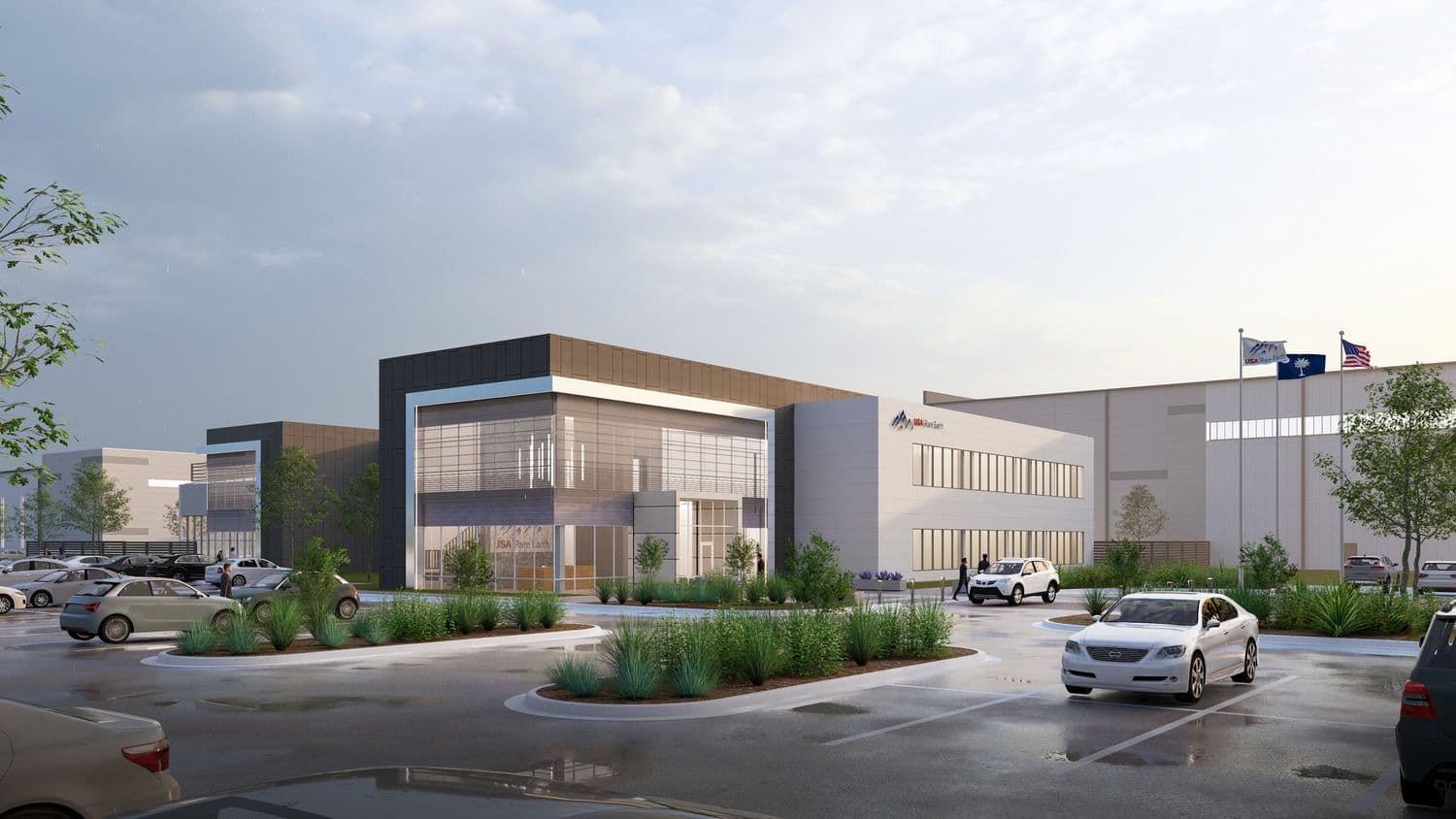 Architectural rendering of USA Rare Earth's planned rare earth magnet and metal manufacturing facility in Blacksburg, South Carolina, with company signage and flags at the entrance