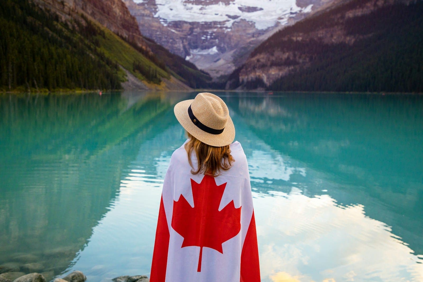 unknown person standing near body of water