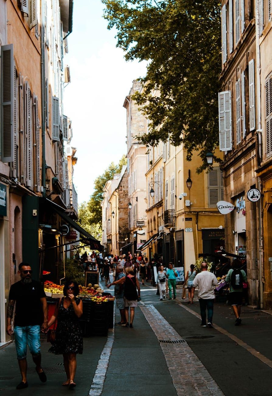Explore the vibrant streets of Aix-en-Provence, capturing the essence of summer and local life.
