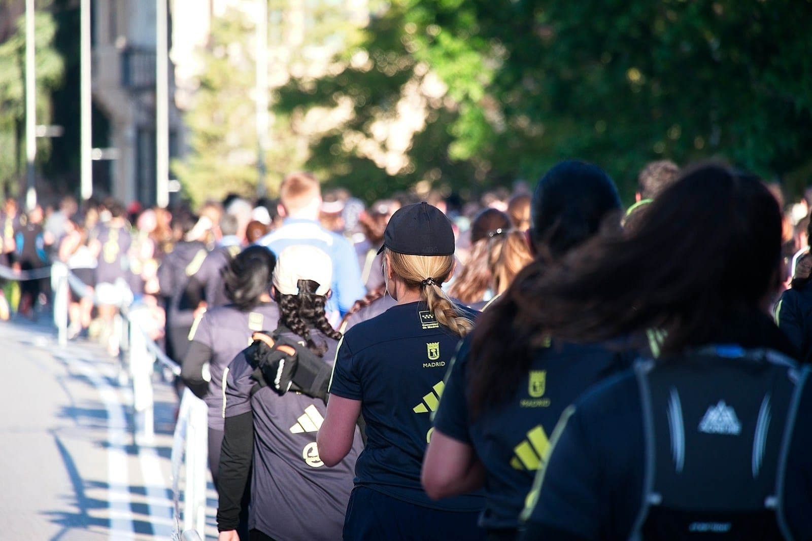 a crowd of people walking down a street