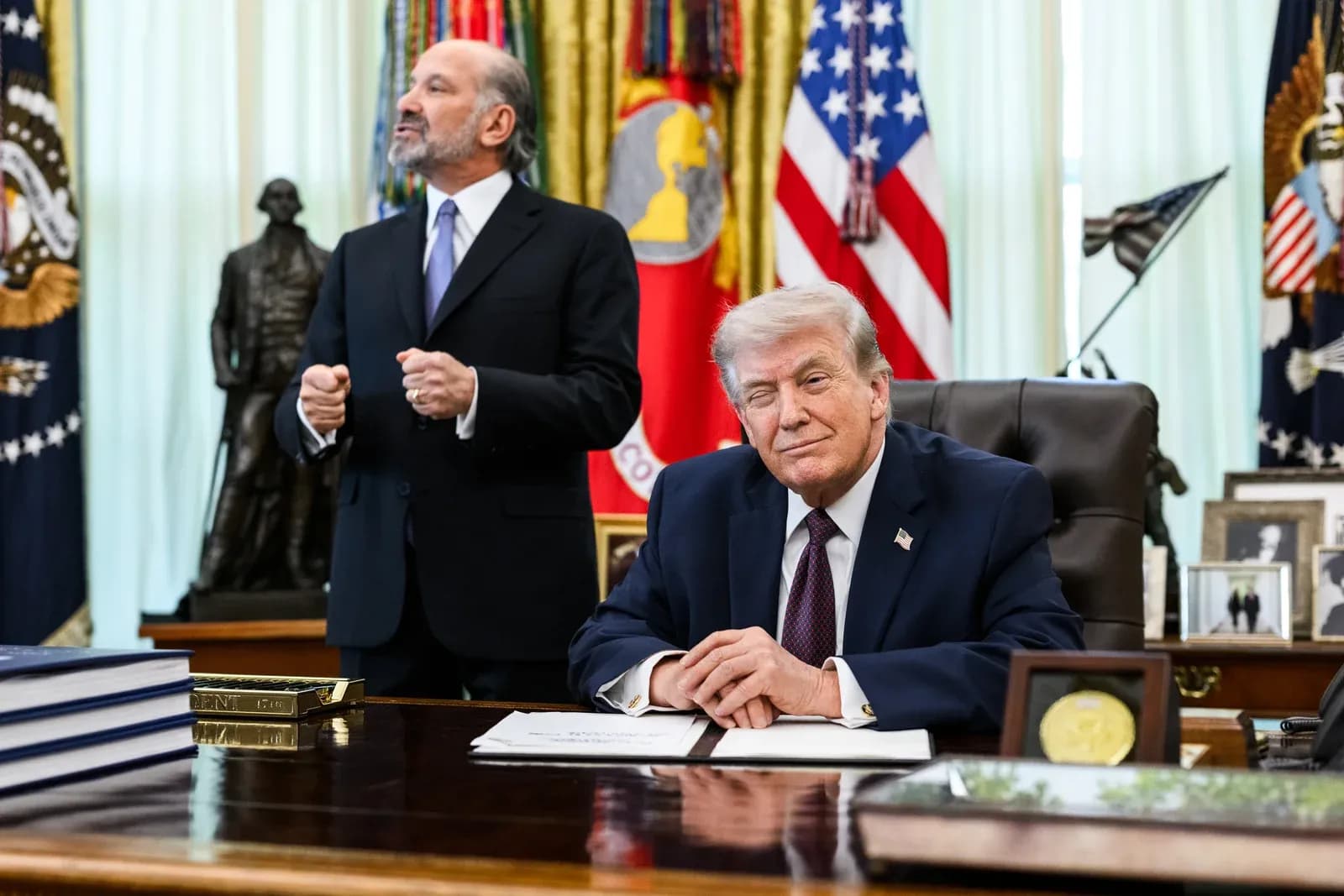 President Donald Trump signs an executive order in the Oval Office, March 31, 2026. Official White House photo by Joyce N. Boghosian