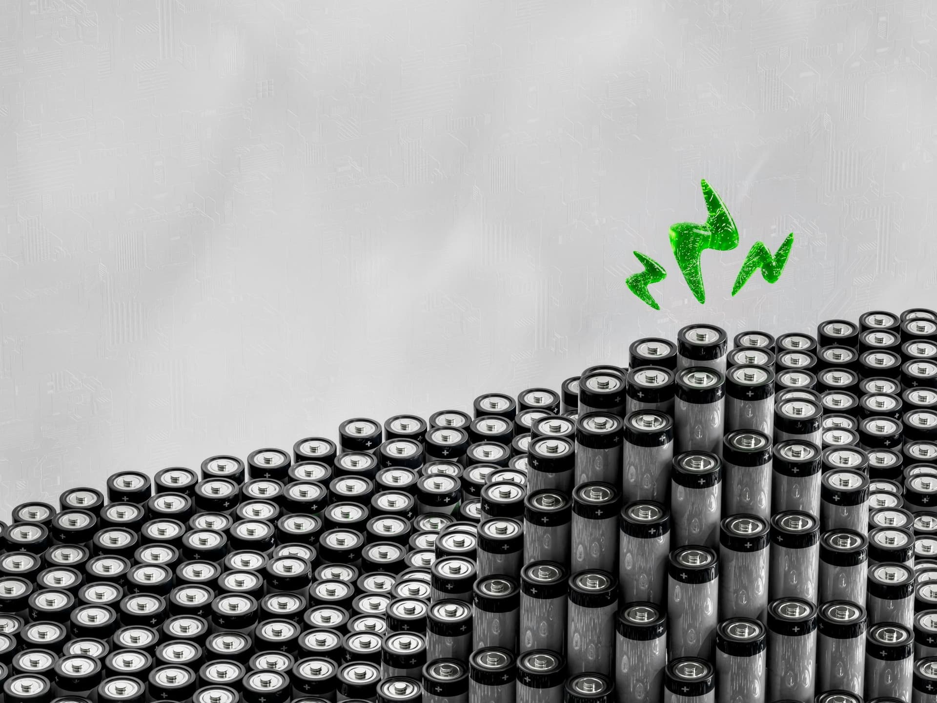 A bunch of black and white objects with a green arrow above them