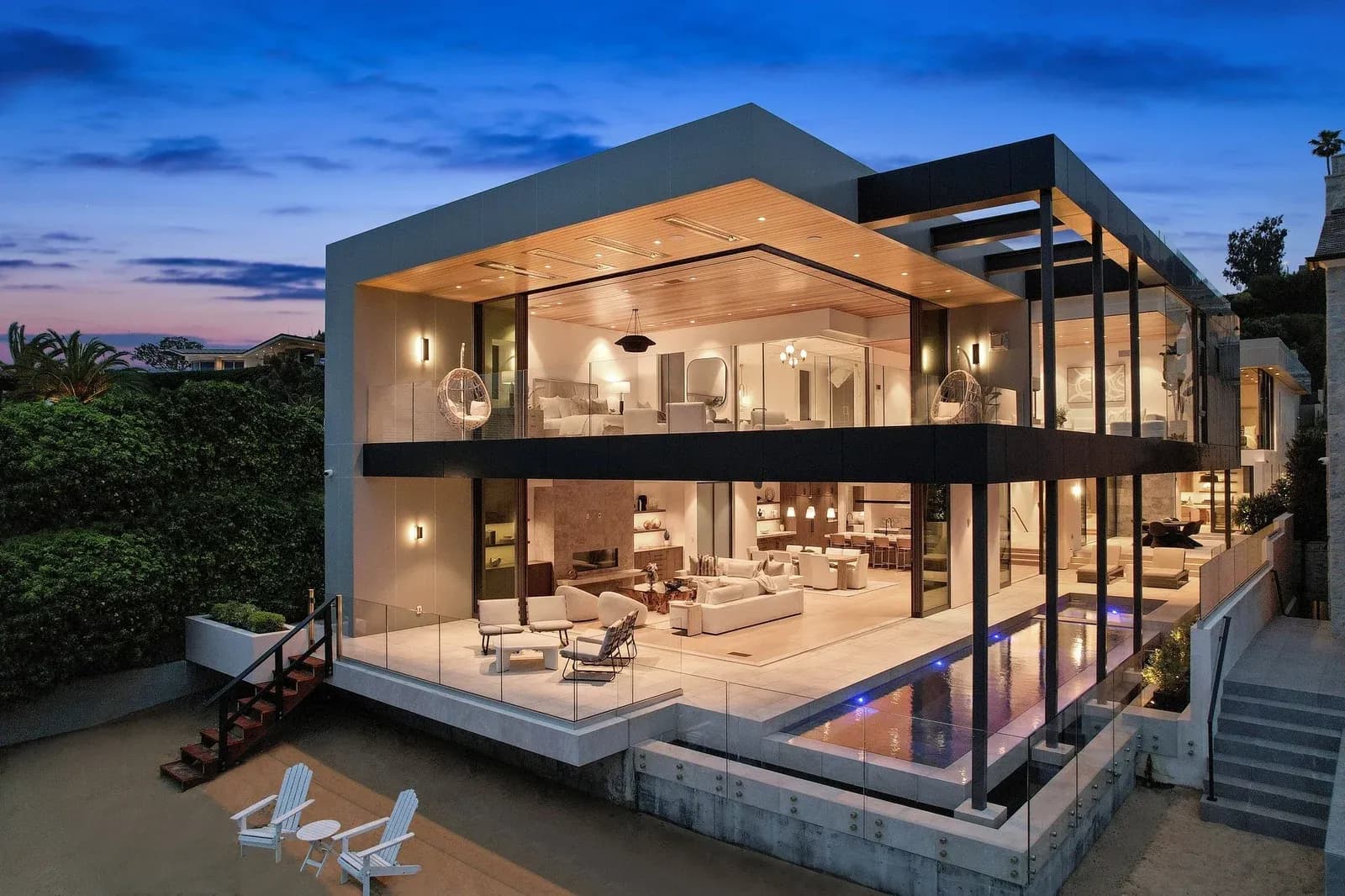 2201 Bayside Drive, Corona del Mar, at dusk. The bayfront house sold off market for 6 million in March 2025 with Garrett Weston representing both sides. Courtesy of MR WESTON + associates