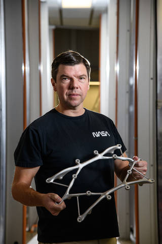 Artificial Intelligence Takes NASA's Hardware Design to New Heights 2 Shown here is Ryan McClelland with a structural mount designed for the STAR-X mission, part of NASA's astrophysics program.