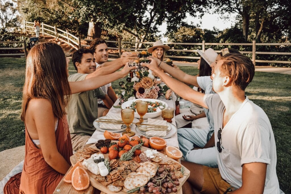 Worrier to Warrior: Expert Strategies to Live Incredibly Full Everyday with Martin Salama 3 people sitting on chair eating food during daytime