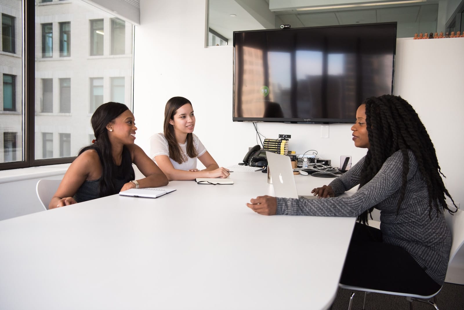 5 Essential Strategies for Successful International Recruitment, According to an Industry Expert 1 three women sitting at the table
