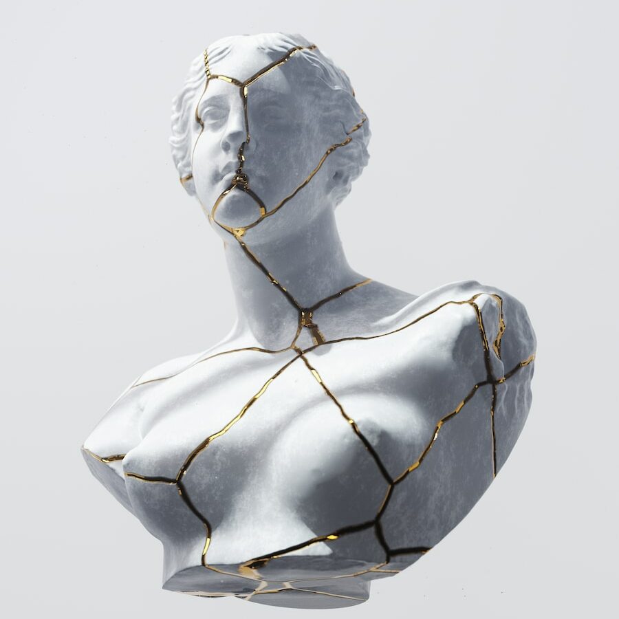 a sculpture of a person with a wire wrapped around it