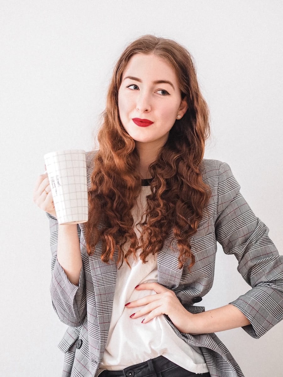The Silent Power of Introverted Leaders in Business 1 woman in gray cardigan holding white ceramic mug