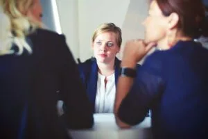 three women sitting during recruitment meeting