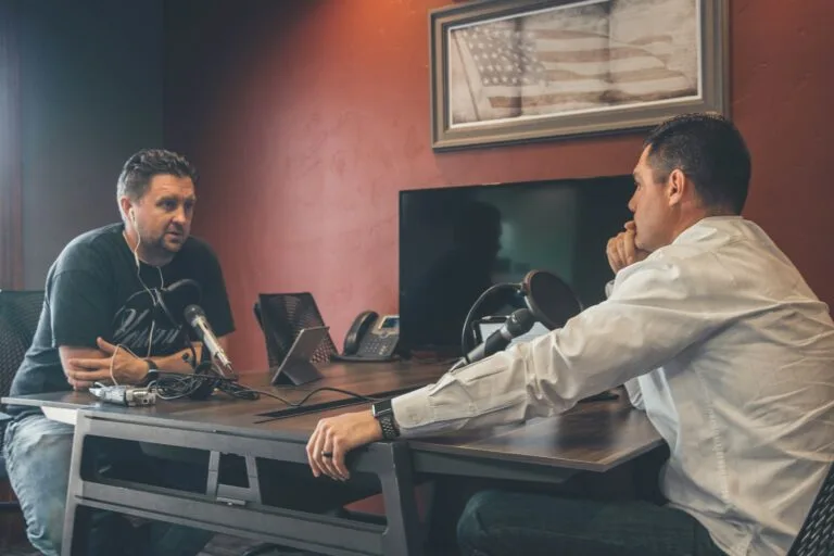 Podcasting As a Path To Thought Leadership: How to Find Your Purpose and Share Your Message 3 man sitting in front of another man also sitting inside room