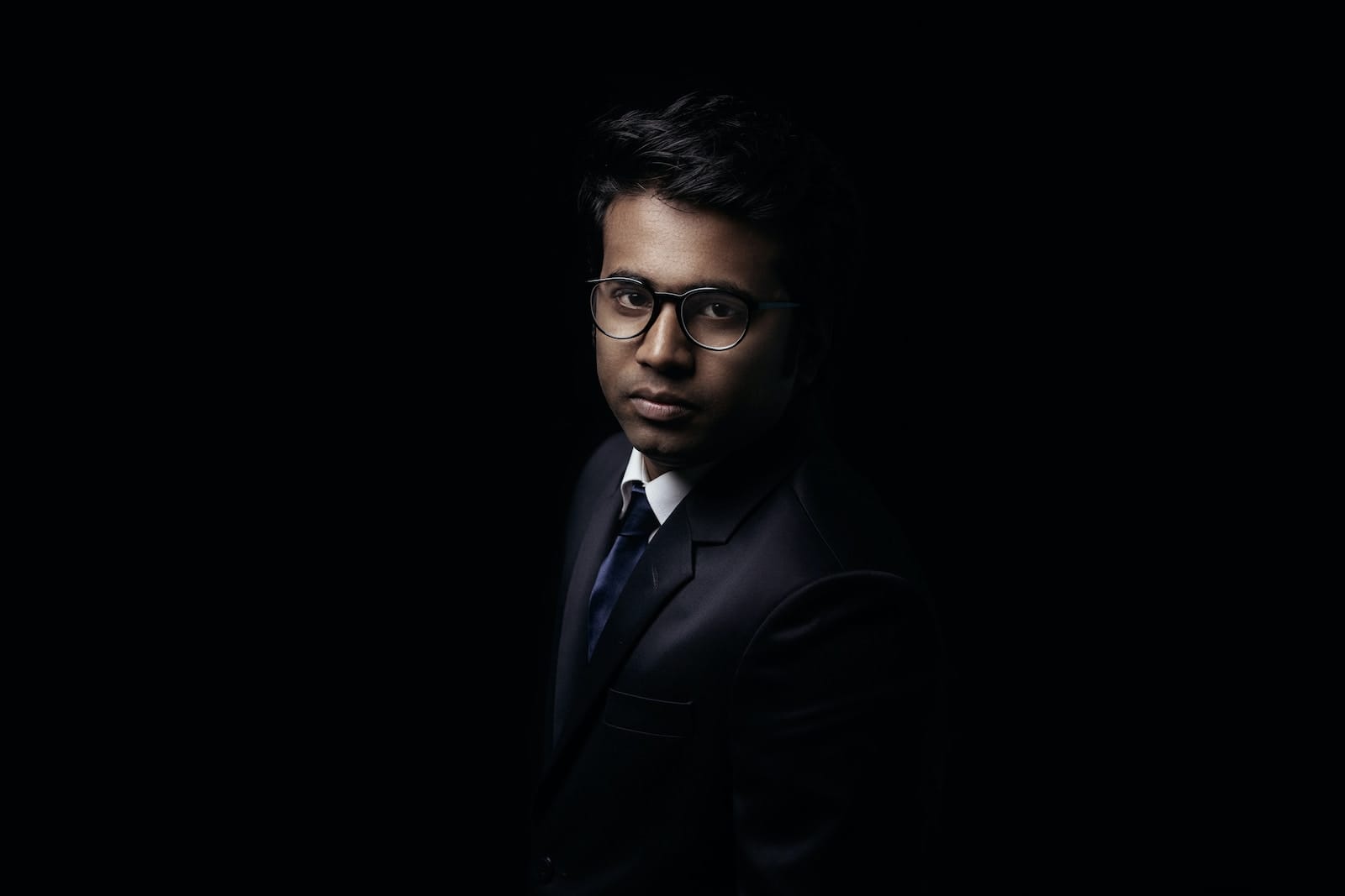 Inside an Executive Mind: The Hidden Power of Intuition in Decision-Making 1 man in black suit jacket wearing black framed eyeglasses