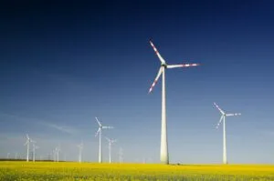 windmills on grass field at daytime
