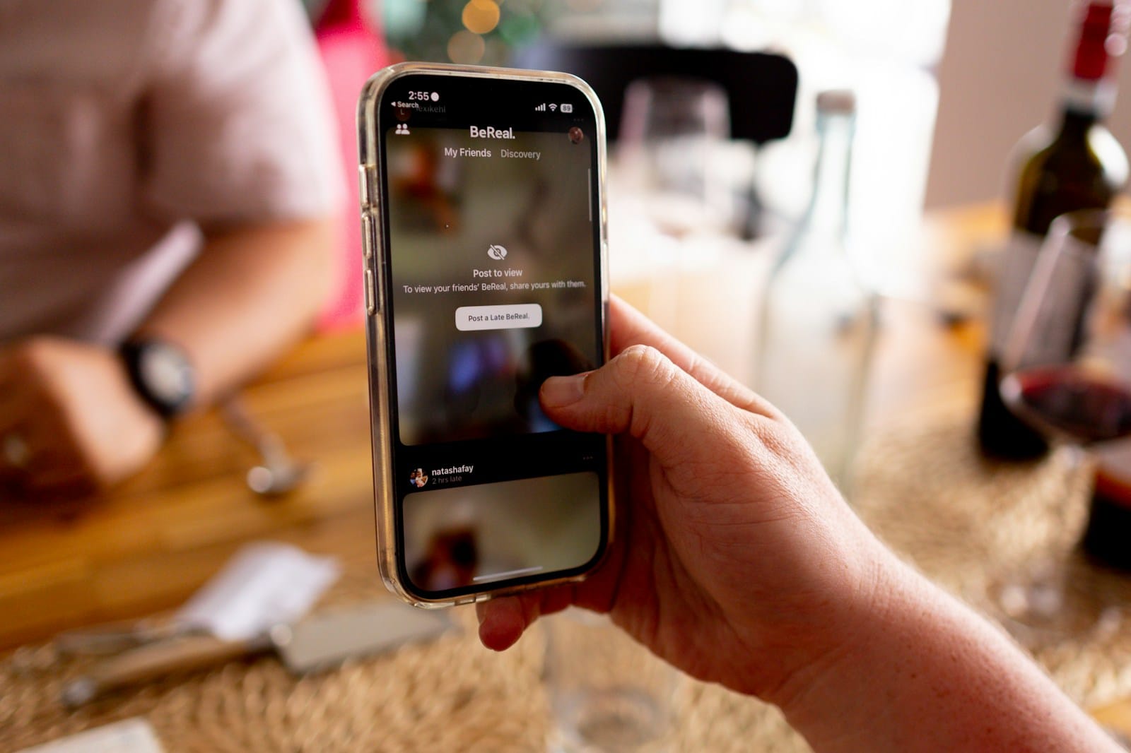 Personal AI Platforms Reshape Social Media Market Dynamics 1 a person holding a cell phone in their hand