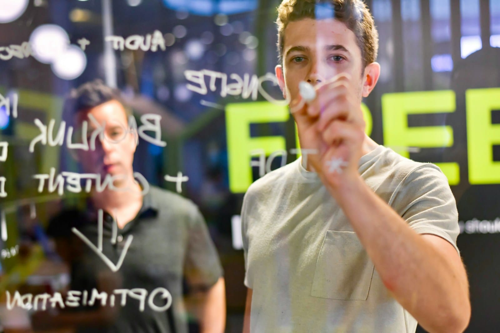 Skilled Trades Get a Digital Boost: What Digital Marketing Actually Means for Trades 1 man writing on glass board