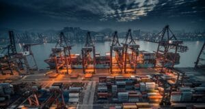 red and black cargo ship on dock during daytime